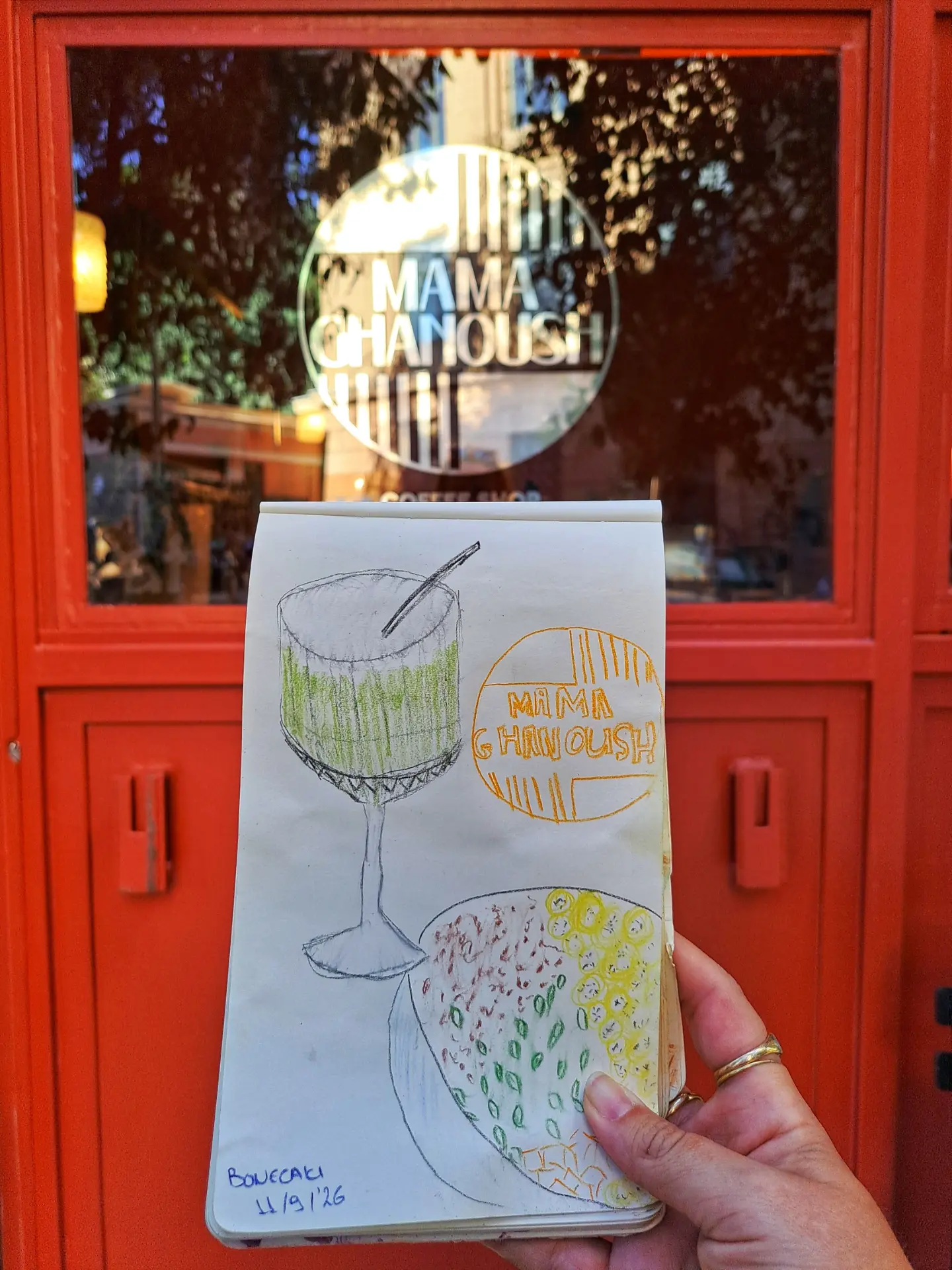A pencil sketch of a matcha glass drawn at the table