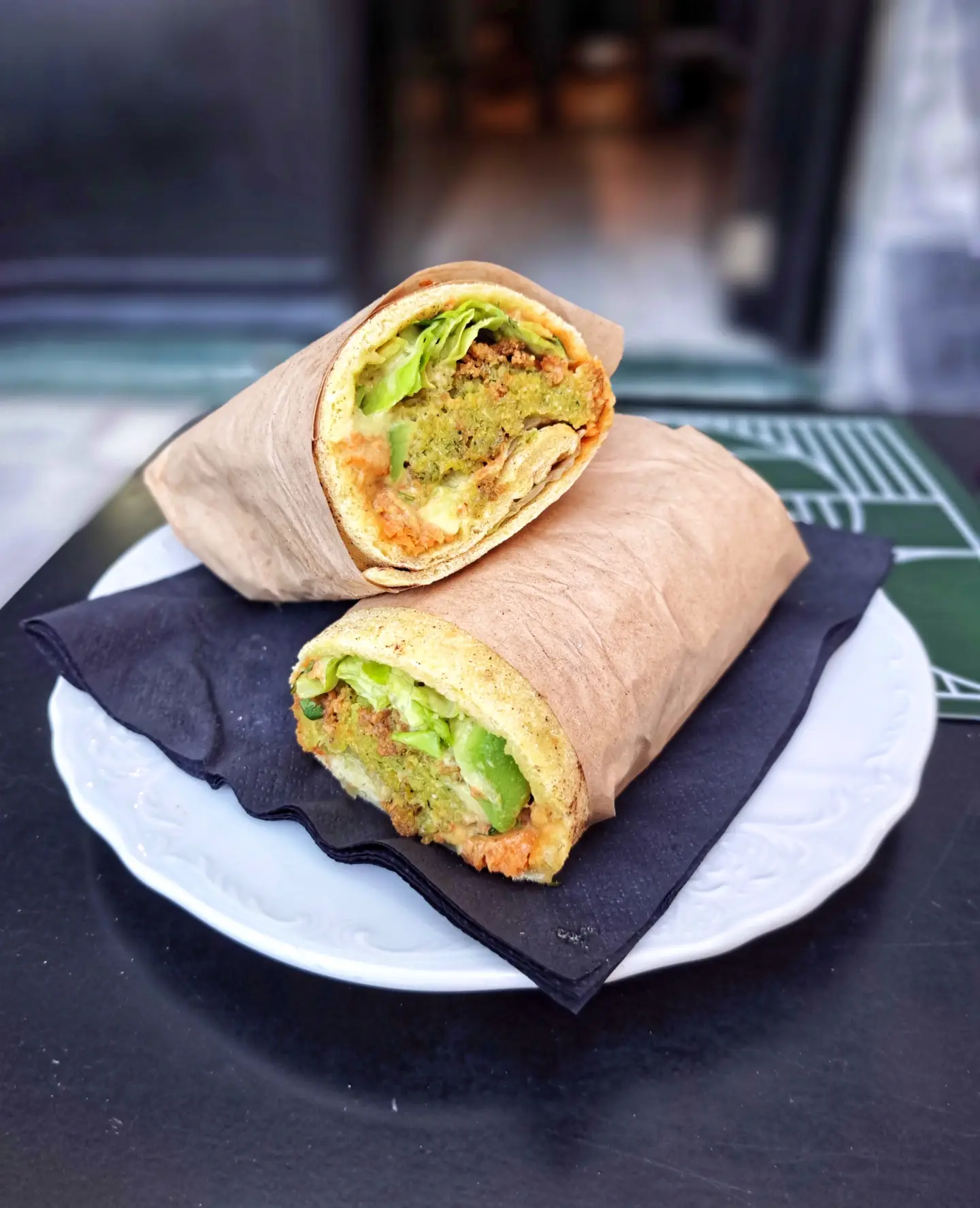 A falafel wrap cut in half